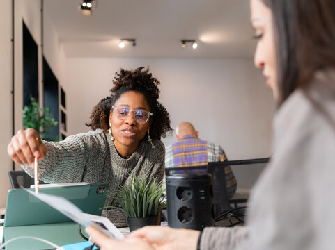 Woman giving professional advice to colleague 