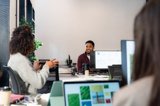 Team Discussion in a Modern Office Setting During Work Hours