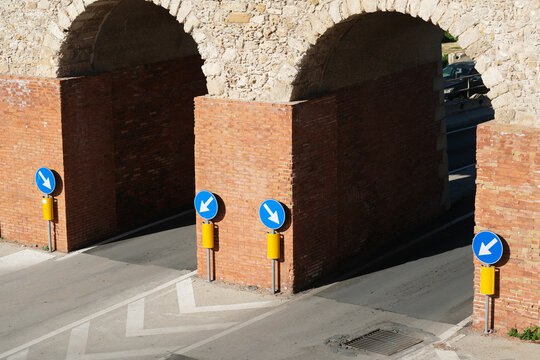 Brick Arch Tunnel Entrance with Road Signs