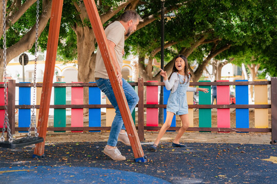 Father playing with daughter 