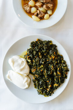 Cooked spinach with yogurt and lamb stew 
