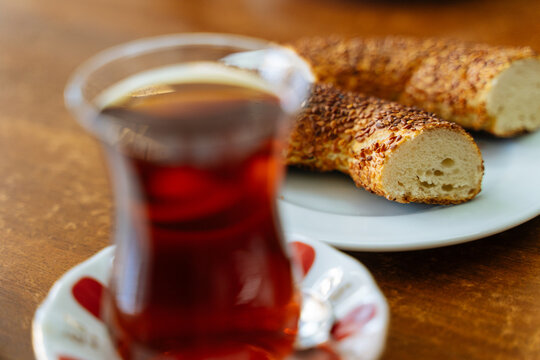 Turkish tea with sliced simit on wooden table