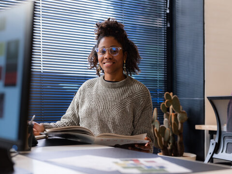 Woman working at office during the day 