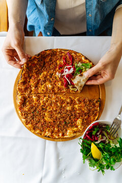 Traditional Turkish lahmacun with fresh salad 