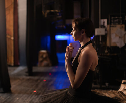 Nervous ballerina rubbing hands before show