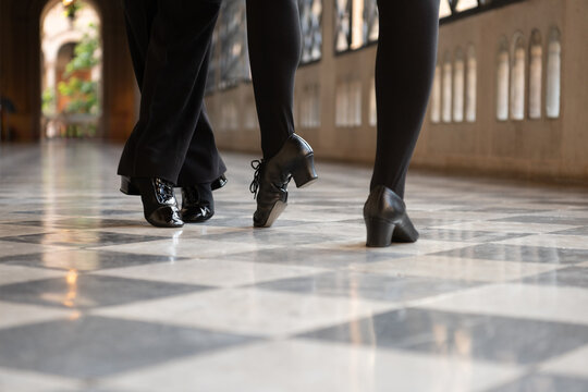 Cropped couple in dancing shoes
