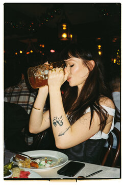 Woman drinks beer