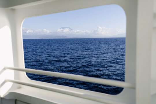 View toward Lombok from ferry window. Island crossing in Indonesia