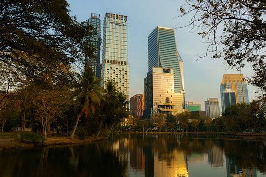 Bangkok cityscape reflecting in the pond of Lumphini park 