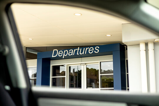 Airport departures sign seen from car in Northern Rivers Australia