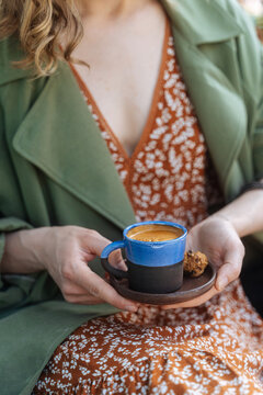 Holding a fresh espresso