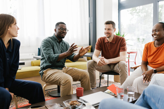 Group of Coworkers Talking in a Cafe During Daytime