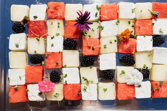 Gourmet cheese and fruit checkerboard arrangement - overhead angle