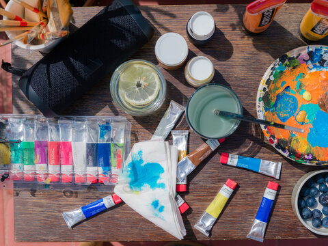Art Supplies Spread out on a Table in Bright Sunlight