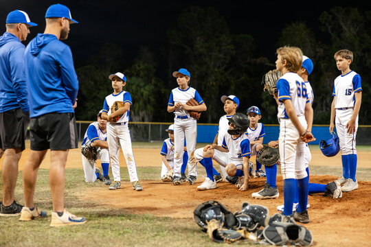 Young Baseball Team Trains Under Night Sky