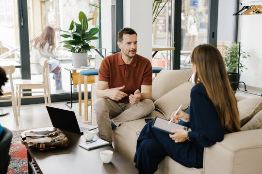 People Working Together on a Project in a Modern Workspace