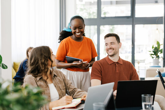 Group of People Working Together in Modern Office Space