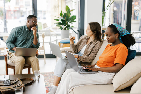 Group of People Working Together in Bright Office Space