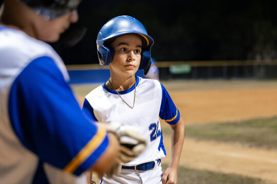 Young Baseball Players Train Under Night Sky