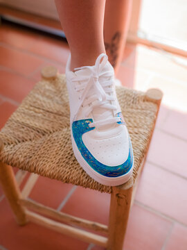 Woman posing in customized shoe 
