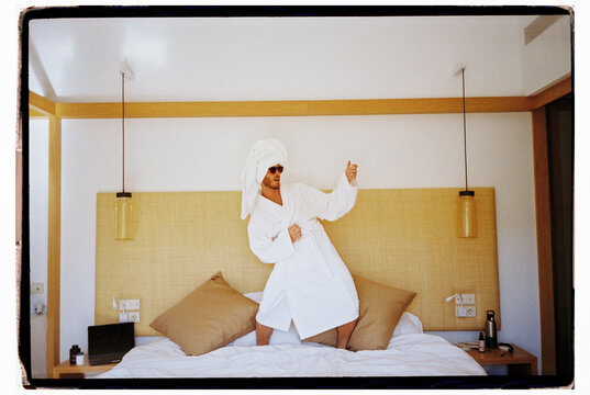 Man Wearing Robe and Towel Dancing in Bed Film Picture