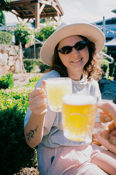 Raising a glass of beer in a celebratory toast 