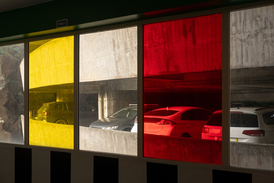 Colored Glass Panels with Parked Cars