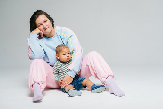 Mom and son on a white background in the studio.