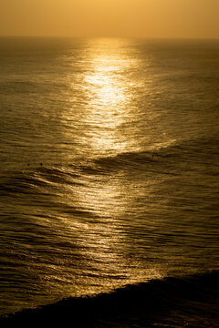 Sunlight reflecting on ocean surface at sunset