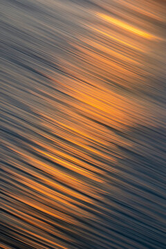 Moved sunset reflection on ocean surface