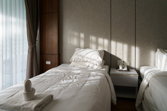 Clean Hotel Room With Two Beds and Natural Light in the afternoon