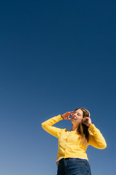 happy young woman listening to music