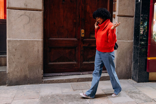 A woman talking on the phone in the city