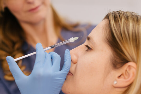 Detail of a doctor applying botox 