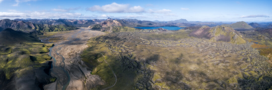 Aerial panorama of lava plain and blue lake, Landmannalaugar