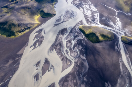 Birdseye view of glacial river splitting on volcanic plain, Iceland