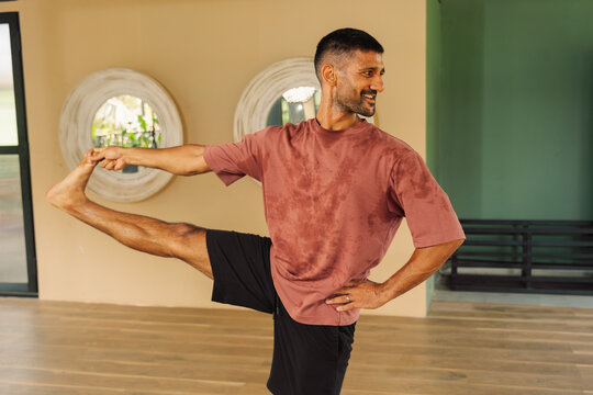 Yoga Practice in a Studio During Morning Time With a Man