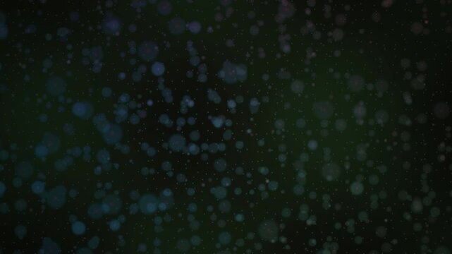 Abstract particle effect floating against a dark green gradient background