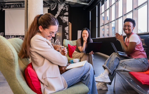 Group of colleagues sharing a light moment in office