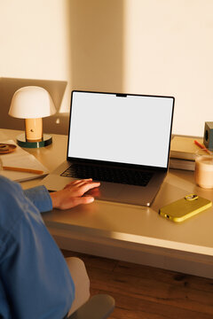 Laptop mockup with white screen at home desk