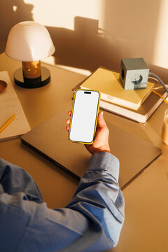 office lifestyle smartphone with white screen mockup at workspace