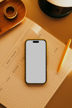 Business office desk with smartphone mockup and blank screen