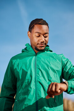 Black Man Checking Smartwatch 