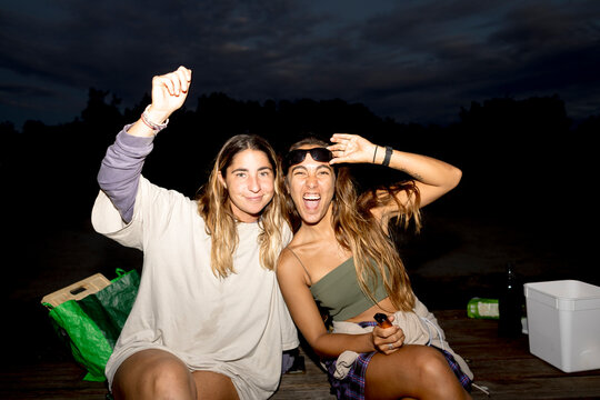 UGC Women posing at picnic table at campsite in Australia with flash