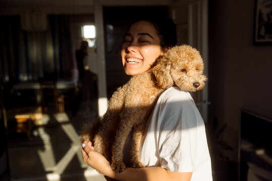 Portrait of a young woman with a dog