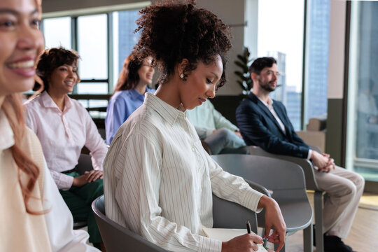 Diverse group of people attending a meeting or conference.