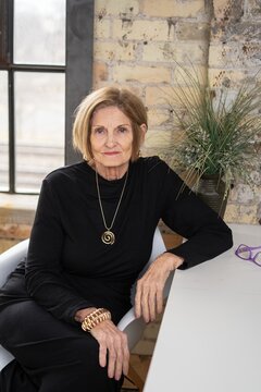 Senior woman Seated in Loft Space
