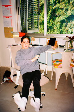 Girl playing on rolling chair