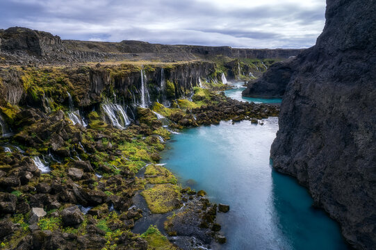 Multiple waterfalls feeding turquoise river, Sig&ouml;lduglj&uacute;fur Iceland
