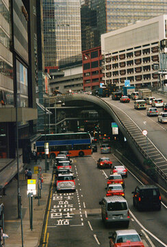Film Photo of Busy Hong Kong Street with Traffic and Skyscrapers
